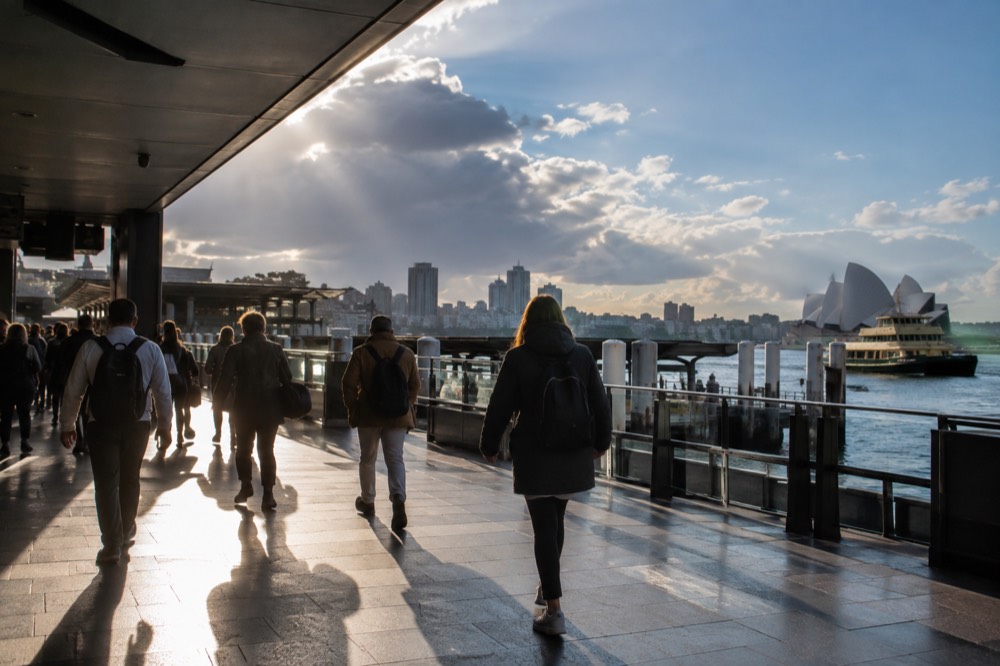 Commuters passing through Opal gates at a Sydney railway station