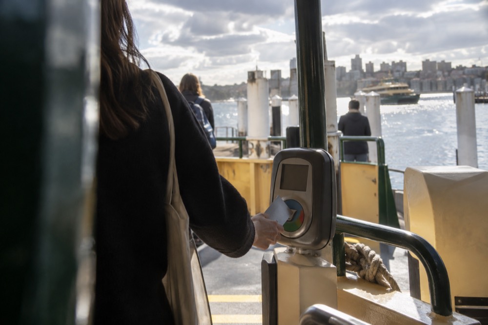 Contactless bank card being tapped on a Sydney ferry card reader