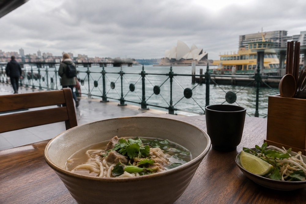 A bowl of noodle soup on a table in a small Sydney eatery