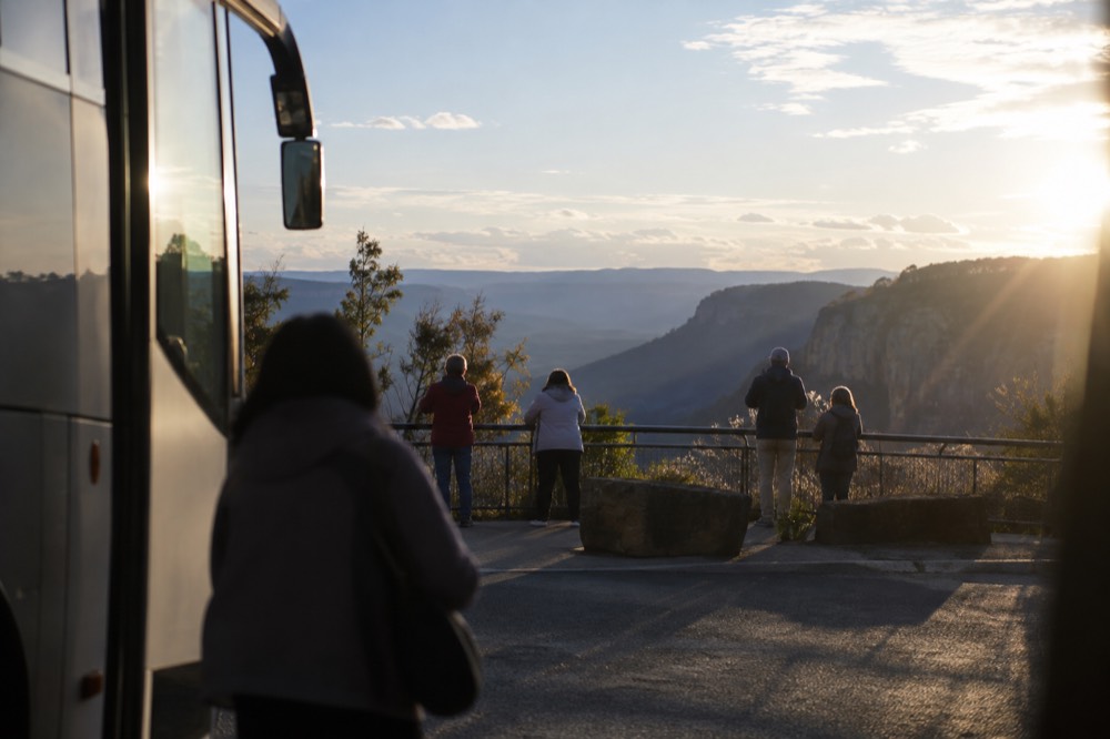 Tour coach parked at a clifftop lookout above the Jamison Valley