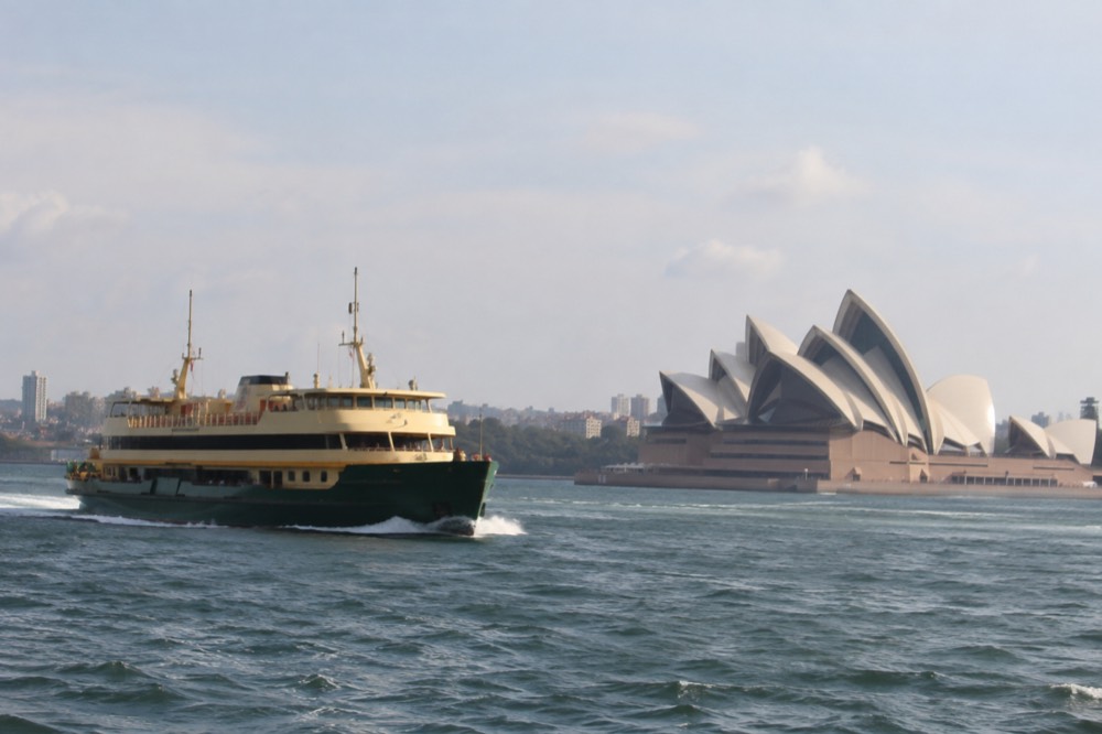 The Manly ferry passing the Sydney Opera House seen from the water