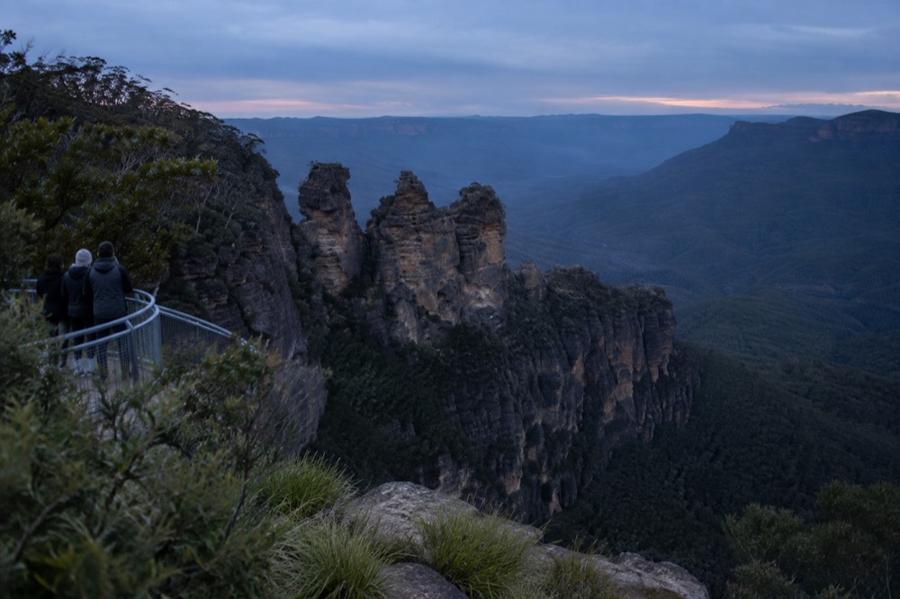 Sandstone cliffs of the Blue Mountains above forested valley at Echo Point