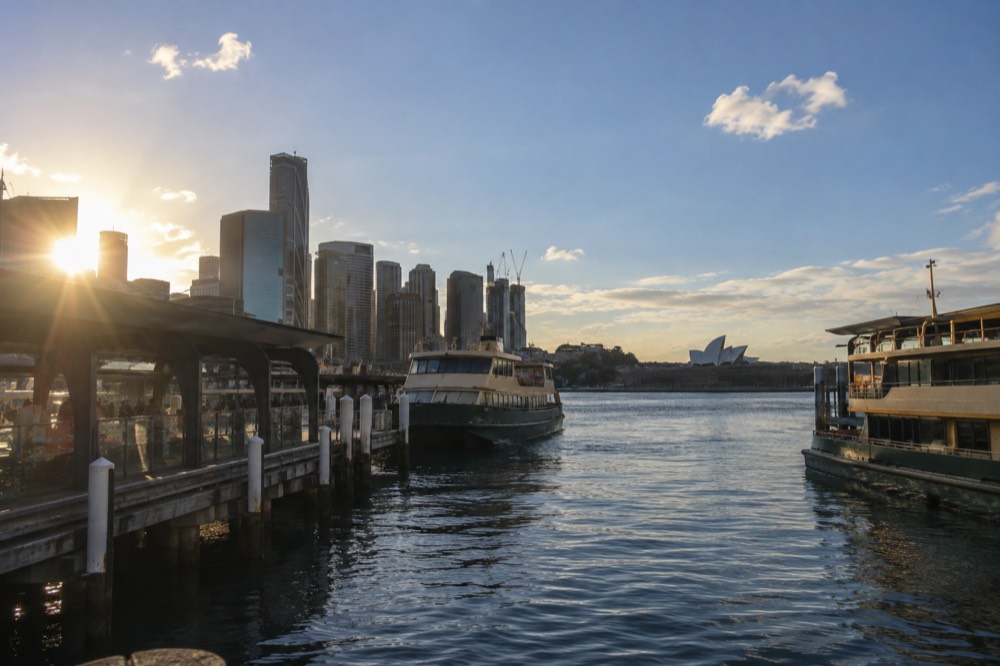 Ferries moored at Circular Quay with the city skyline behind them