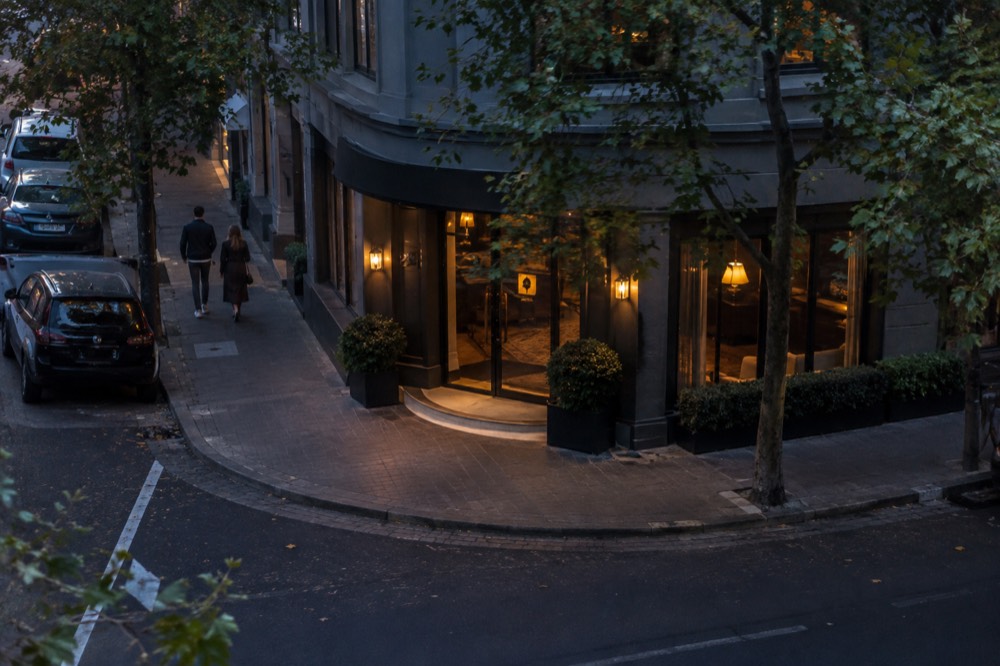 Boutique hotel entrance on a tree-lined Darlinghurst corner
