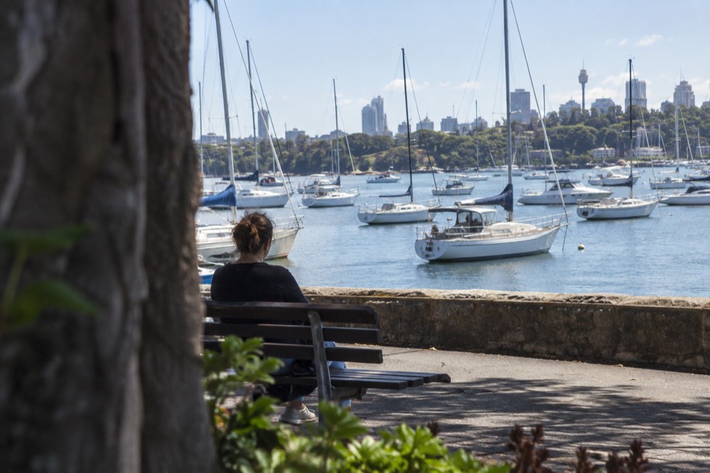 Yachts and small boats moored in the calm water of Woolloomooloo Bay