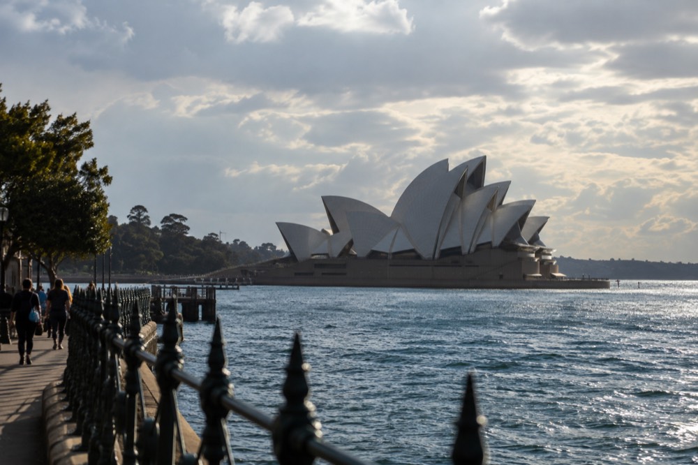 The sandstone steps and white shell roofs of the Opera House from the western boardwalk