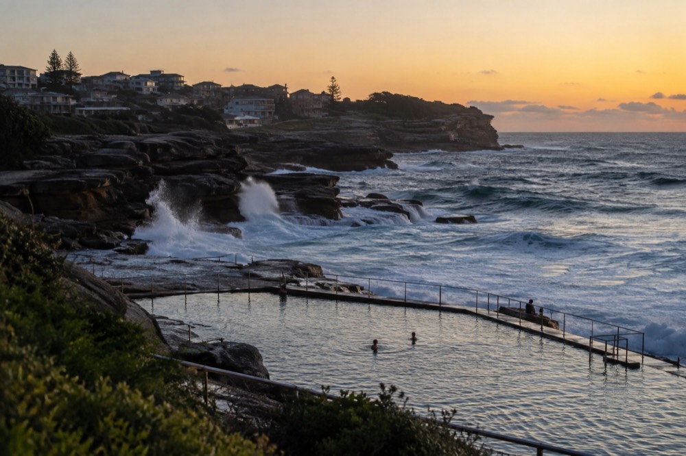 Waves breaking on the rock platform at Bronte with the ocean pool in the foreground