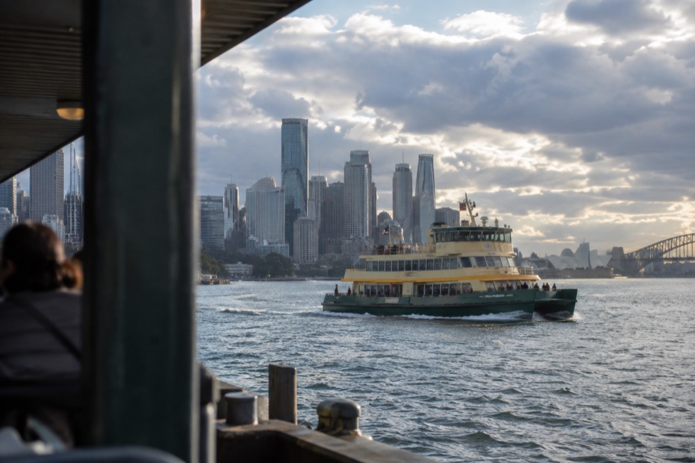 A Sydney ferry on the harbour with the Opera House in the distance