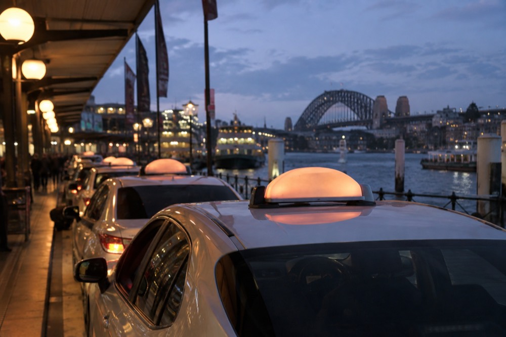 A taxi rank on a Sydney street at dusk