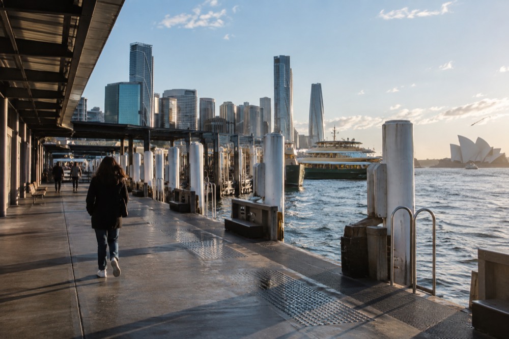 Circular Quay ferry wharves in daylight with the city skyline behind