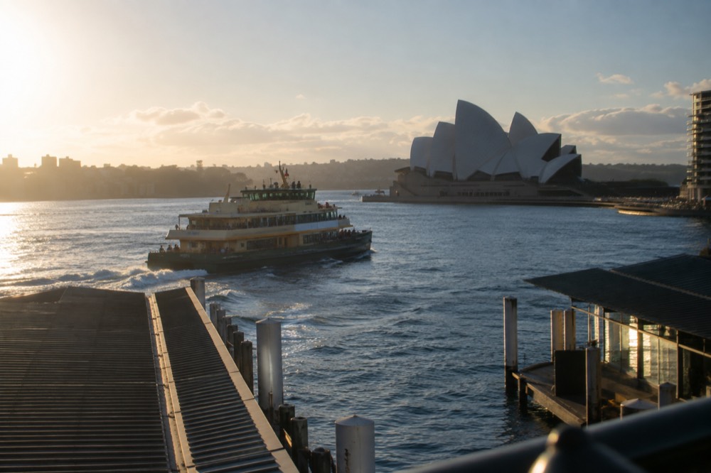 A ferry crossing Sydney Harbour with the Opera House in the background
