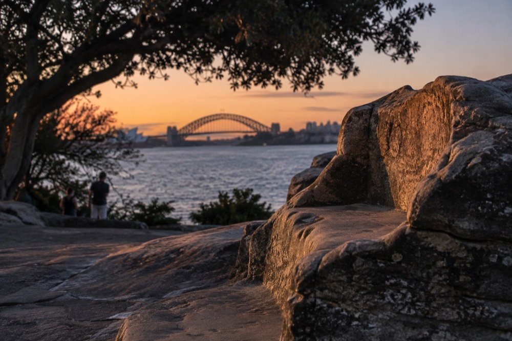 First light hitting the sandstone of Mrs Macquarie's Chair with the Harbour Bridge in the background