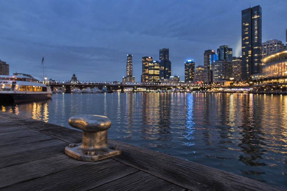 Evening lights reflecting across Darling Harbour water