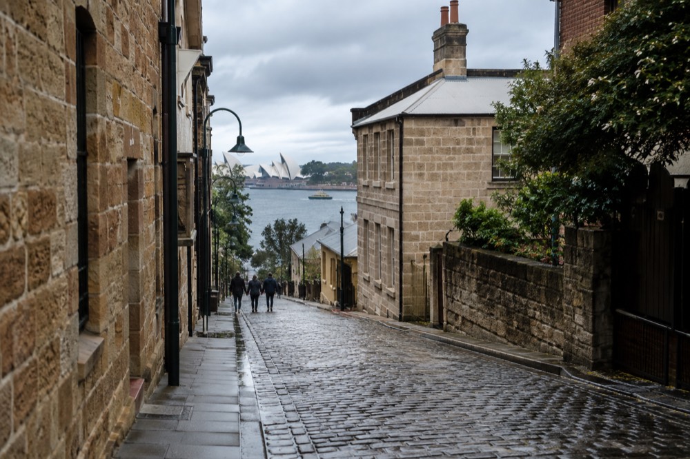 Sandstone buildings and cobbled lane in The Rocks at mid-morning