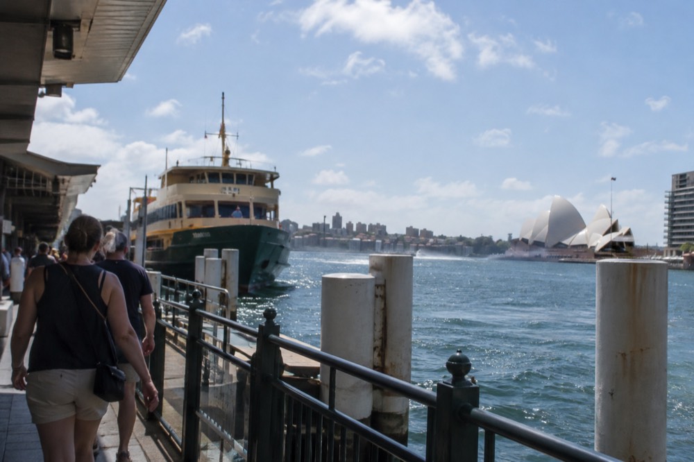 Sydney skyline and harbour water under bright summer sky